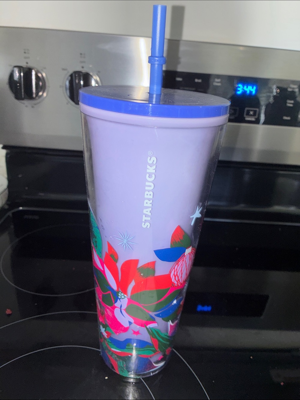 Starbucks Lavender Tumbler with Bright Floral Accent and Blue Lid